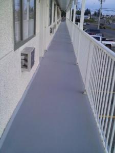 a walkway outside of a building at Caravan INN in Quesnel