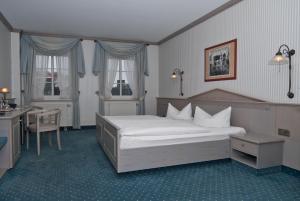 Säng eller sängar i ett rum på Hotel DREI SCHWANEN - Ristorante Due Fratelli