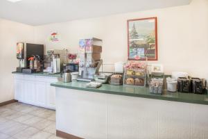 a counter in a coffee shop with a counter top at Super 8 by Wyndham Houghton Lake in Houghton Lake