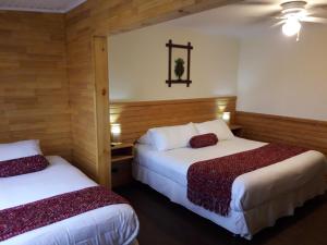 Postel nebo postele na pokoji v ubytování Dein Haus Hotel y Departamentos