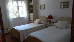 Postel nebo postele na pokoji v ubytování Casa Somoza