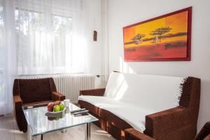 A seating area at Andrássy Apartment with Inside Parking