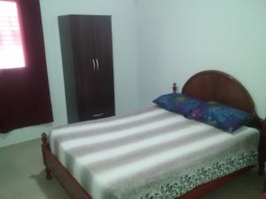En eller flere senge i et værelse på Cabañas Plaza Norte