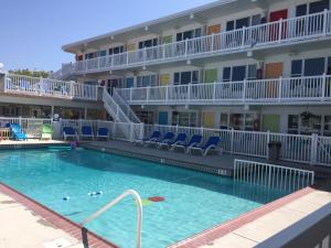 a large swimming pool in front of a hotel at Lollipop Motel in North Wildwood