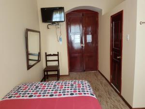 Postel nebo postele na pokoji v ubytování Hostal Buenos Aires