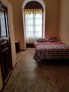 Postel nebo postele na pokoji v ubytování Hostal Buenos Aires