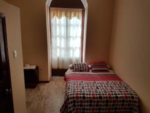 Postel nebo postele na pokoji v ubytování Hostal Buenos Aires