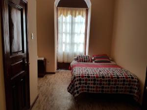 Postel nebo postele na pokoji v ubytování Hostal Buenos Aires