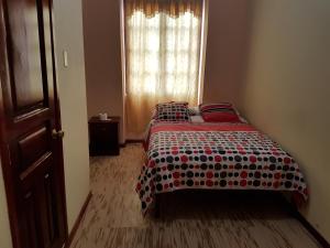 Postel nebo postele na pokoji v ubytování Hostal Buenos Aires