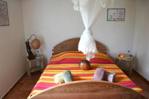 Ένα ή περισσότερα κρεβάτια σε δωμάτιο στο GITES de L'ECOMUSEE CREOLE