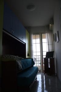 a bedroom with a bed and a sliding glass door at Patrancarro Home - Letojanni Taormina in Letojanni