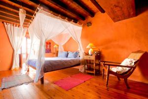 Ένα ή περισσότερα κρεβάτια σε δωμάτιο στο Casa El Morro
