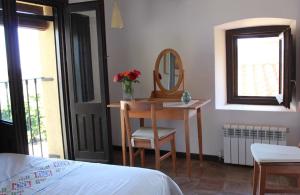 Postel nebo postele na pokoji v ubytování Casa Rural Hosteria Cantarranas