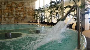 a swimming pool with a large pool of water at Crowne Plaza Vilamoura - Algarve, an IHG Hotel in Vilamoura