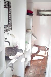 a bathroom with a sink and a toilet at Das Trafohaus in Solingen