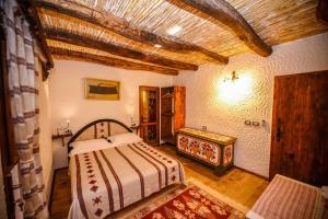 Llit o llits en una habitació de Hotel Tradita 37 fotos més