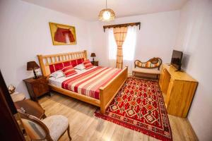 Voodi või voodid majutusasutuse Hotel Tradita toas