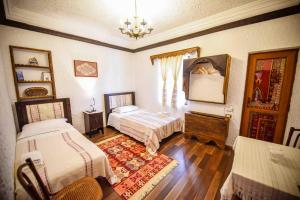 Voodi või voodid majutusasutuse Hotel Tradita toas