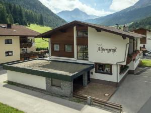 an aerial view of a building with mountains in the background at Haus Alpengruß in Sölden