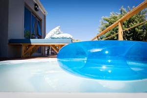 a large blue bowl sitting on top of a swimming pool at Seabreeze in Kommetjie