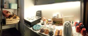 a counter in a room with food on it at Hotel Flora in Hannover