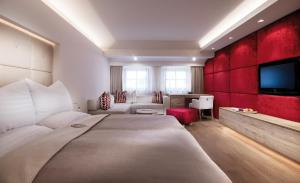 Rúm í herbergi á Schwarzer Adler Kitzbühel - Adults Only