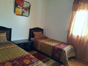 Voodi või voodid majutusasutuse Chalet Asmoun toas