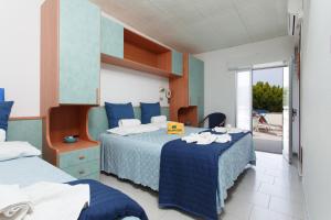 Postel nebo postele na pokoji v ubytování Hotel San Pietro