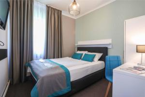 a hotel room with a bed and a window at Hotel Sokak in Sarajevo