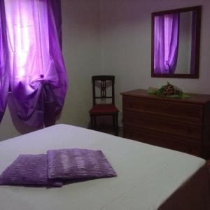 A bed or beds in a room at Villa Orizzonte