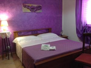 A bed or beds in a room at Villa Orizzonte