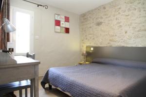 Postel nebo postele na pokoji v ubytování Hotel Saint Germain