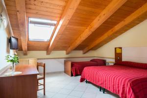 Posteľ alebo postele v izbe v ubytovaní B&B Il Girasole