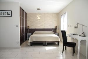 Postel nebo postele na pokoji v ubytování Hotel Saint Germain