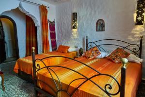 Cama o camas de una habitación en Dar Yakout
