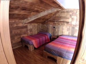 Postel nebo postele na pokoji v ubytování Hotel Biancaneve