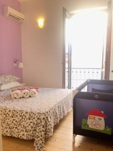Un pat sau paturi într-o cameră la Appartamenti Pozzallo