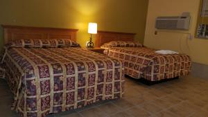 Letto o letti in una camera di Luxury Inn
