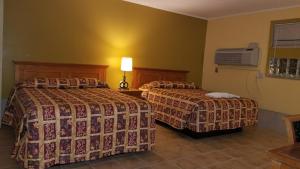 Letto o letti in una camera di Luxury Inn