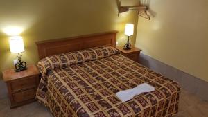 Letto o letti in una camera di Luxury Inn