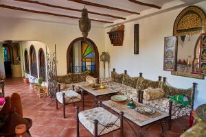 a living room with a couch and a table at Dar Yakout in Chefchaouen