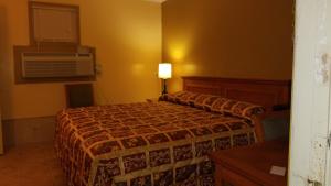 Letto o letti in una camera di Luxury Inn