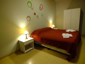 Una cama o camas en una habitación de Hostal Amalaya