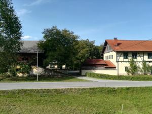 an empty road in front of two buildings at Apartma 5 in Radovljica