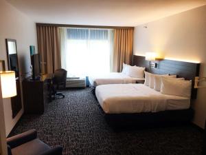 Voodi või voodid majutusasutuse Gundersen Hotel & Suites toas
