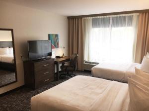 Voodi või voodid majutusasutuse Gundersen Hotel & Suites toas