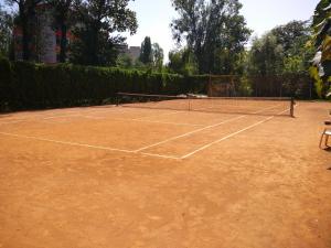 a tennis court with a net on it at Inn Sport in Chernivtsi