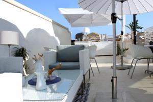Posezení v ubytování CinqueSuites Ortigia