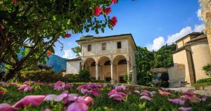a field of flowers in front of a building at Al vicolo del Gallo in Varallo