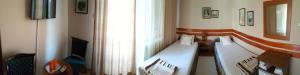Postel nebo postele na pokoji v ubytování Guest House Major